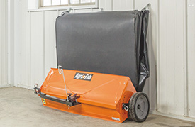 45-0492 44" lawn sweeper folded for storage, a compact and efficient leaf sweeper attachment.